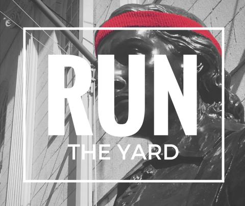 Image of the John Harvard Statue wearing a Harvard Crimson red sweatband like a runner, overwritten with the text RUN THE YARD